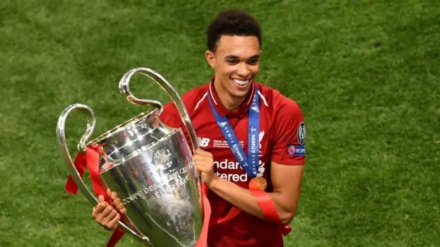 Trent Alexander-Arnold with the Champions League trophy in 2019