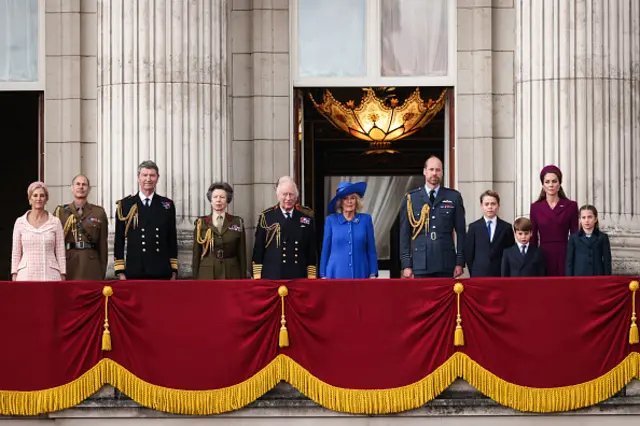 Britain's Sophie, Duchess of Edinburgh, Britain's Prince Edward, Duke of Edinburgh, Vice Admiral Timothy Laurence, Britain's Princess Anne, Princess Royal, Britain's Prince Edward, Duke of Kent, Britain's King Charles III, Britain's Queen Camilla, Britain's Prince William, Prince of Wales, Britain's Prince George of Wales, Britain's Prince Louis of Wales, Britain's Catherine, Princess of Wales and Britain's Princess Charlotte of Wales stand to the national anthem on the balcony of Buckingham Palace