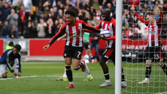 Brentford's Kevin Schade celebrates scoring his second goal against Manchester United in May 2025