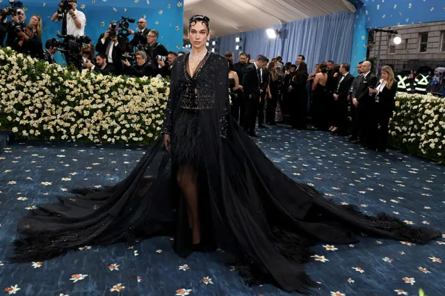 Singer Dua Lipa in an all black dress