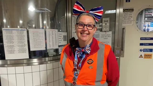 Claire Snelling wears an orange high-vis, along with Union Jack themed accessories