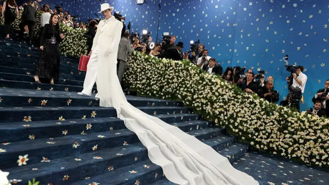 Gustav Magnar Witzoe wearing a white tux with a long white train.