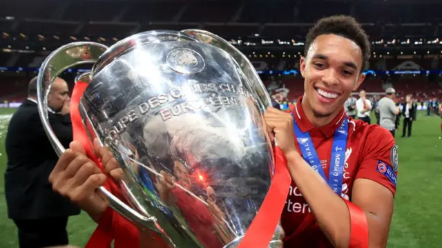 Trent Alexander-Arnold with the Champions League trophy in 2019