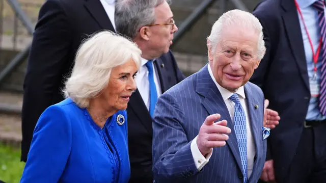 King Charles and Queen Camilla walking
