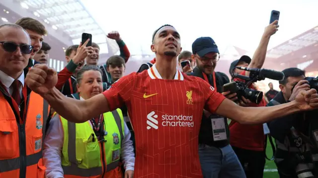 Trent Alexander-Arnold celebrates Liverpool winning the Premier League title