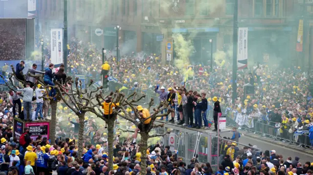 Thousands of fans lining the streets of Leeds city centre.