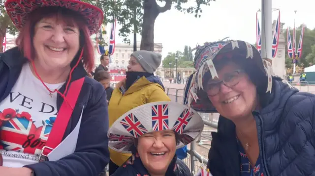 Susan and two friends wearing Union Jack clothing on the Mall