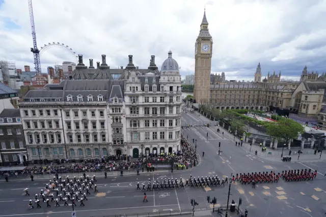 Birds eye view of Members of the armed forces leaving Parliament Square during a military procession