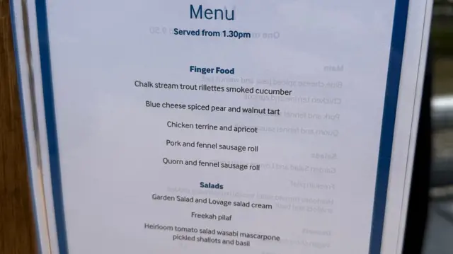 Picture of a menu of finger foods and salad