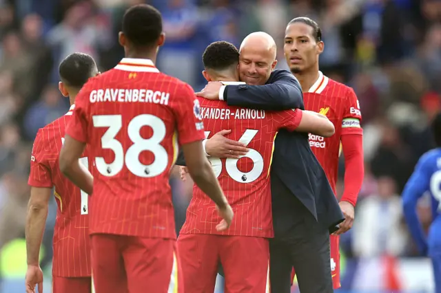 Arne Slot hugs Trent Alexander-Arnold after Liverpool won the title