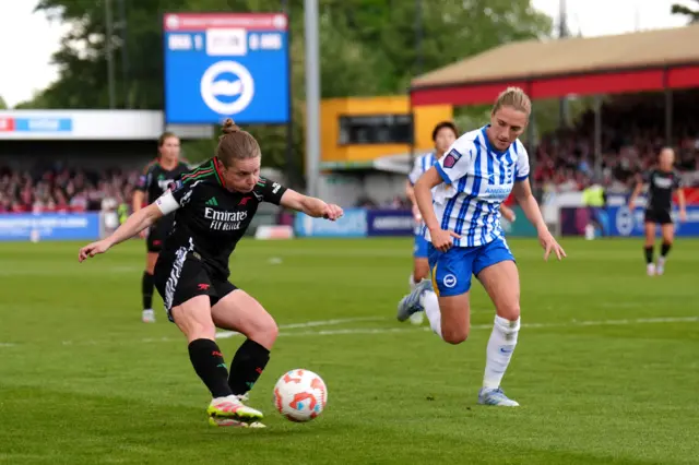 Arsenal's Kim Little (left) attempts a shot on goal