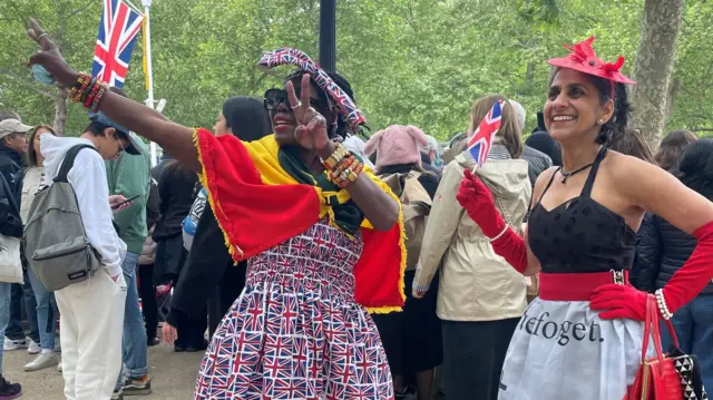 Grace Gothard and Satvinder Cubb strike poses in their handmade outfits