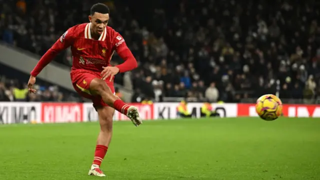 Trent Alexander-Arnold passes the ball