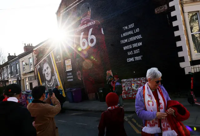 Fans take pics of TAA mural