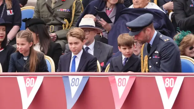 Prince William sat next to Prince George, Princess Charlotte and Prince Louis - all of them in smart outfits