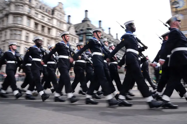 Dozens of the Royal Navy march through Parliament Square