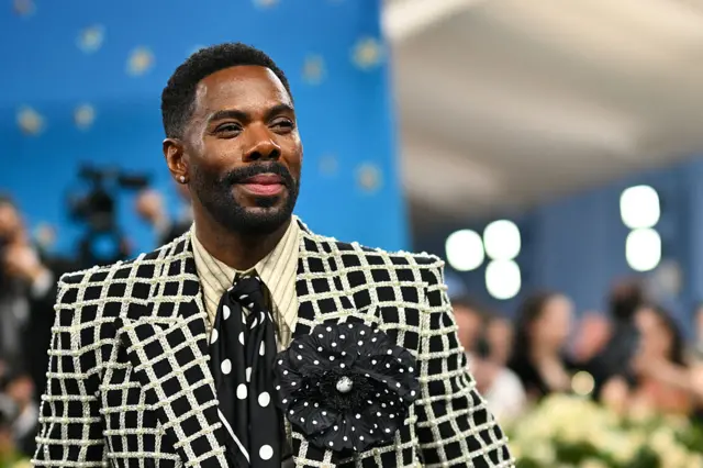 Colman Domingo's polka-dotted flower pin.