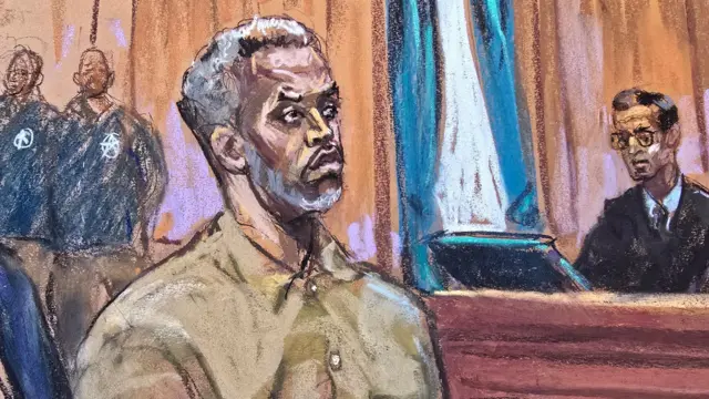 FILE IMAGE: Sean "Diddy" Combs stands as he is arraigned on a superseding indictment ahead of his May trial on sex trafficking charges