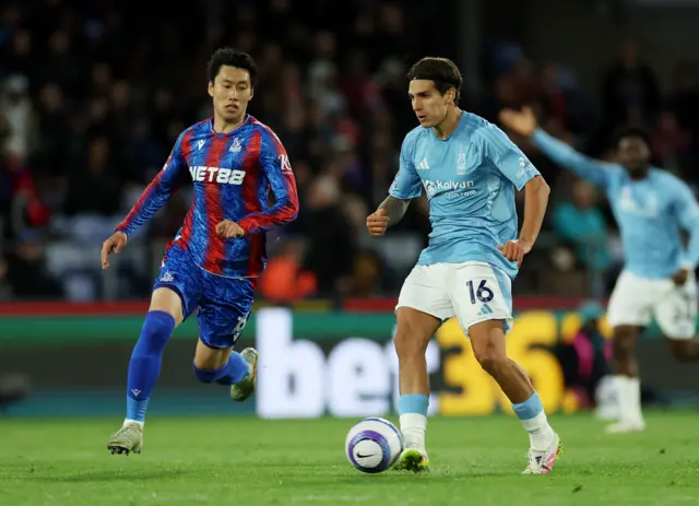 Crystal Palace's Daichi Kamada in action with Nottingham Forest's Nicolas Dominguez
