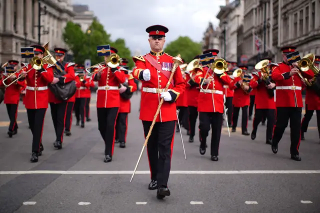 Members of the Royal Corps of Army Music march in Parliament Square
