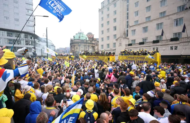Thousands gathered in City Square to catch a glimpse of the three yellow buses carrying the Leeds players and staff