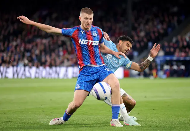 Adam Wharton of Crystal Palace battles for possession with Morgan Gibbs-White of Nottingham Forest during the Premier League match between Crystal Palace FC and Nottingham Forest FC at Selhurst Park