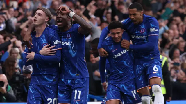 Cole Palmer celebrates with his Chelsea team-mates after against Liverpool in May 2025