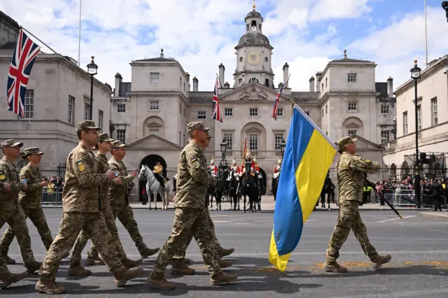 Ukrainian soldiers walk down the Mall