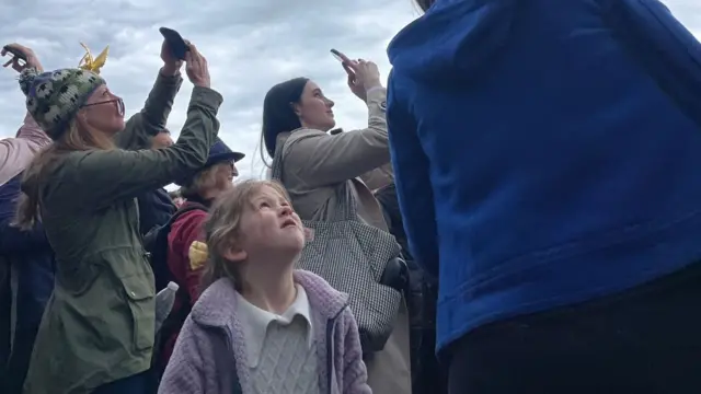 Young girl looking up