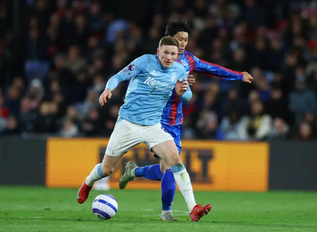 Nottingham Forest's Elliot Anderson in action with Crystal Palace's Daichi Kamada