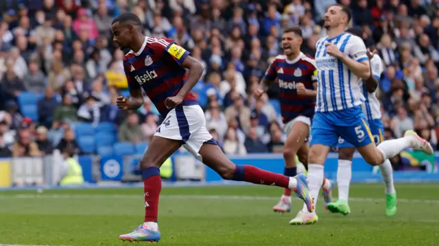 Alexander Isak runs away after scoring a penalty for Newcastle at Brighton