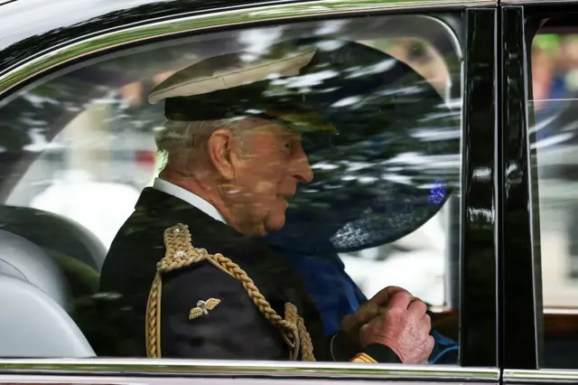 King Charles III arrives in a black car