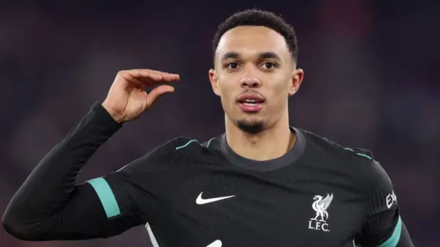 Trent Alexander-Arnold does a 'chat' gesture in celebration at scoring against West Ham