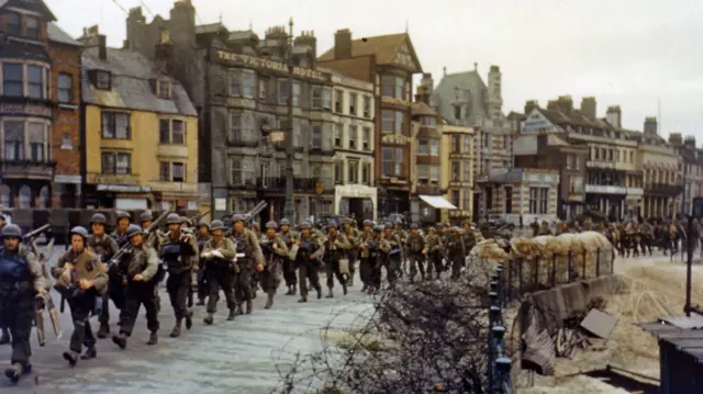 Soldiers marching along Weymouth seafront in 1944
