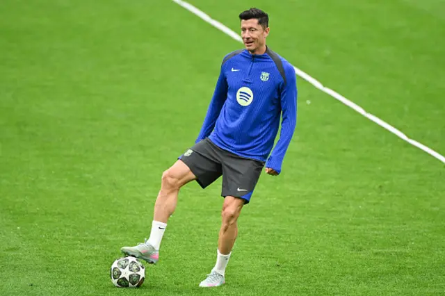 Robert Lewandowski reacts as he attends a training session