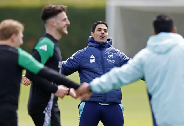 Declan Rice in the middle as Arsenal players hold hands
