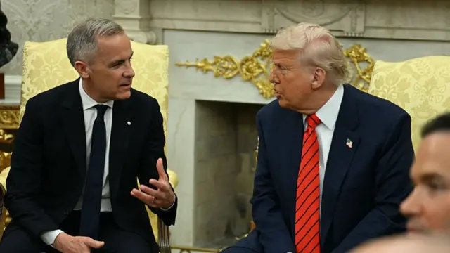Trump and Carney conversing in the Oval Office
