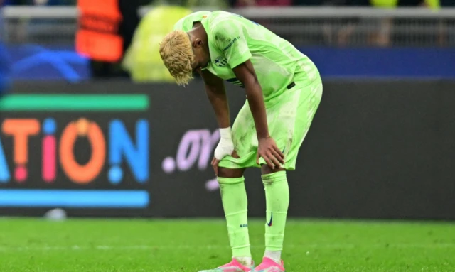 FC Barcelona's Lamine Yamal looks dejected