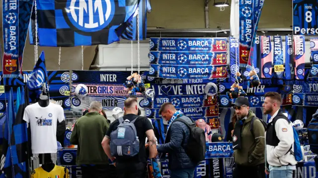 Inter Milan scarfs and merchandise are seen on sale outside the stadium