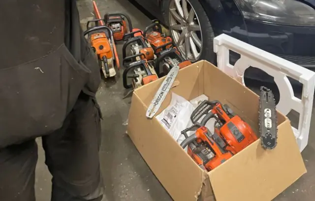 A box of chainsaws