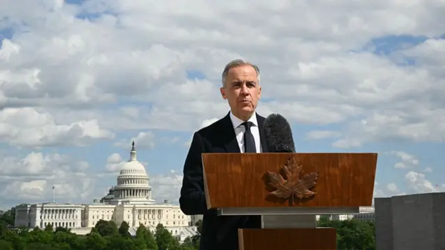 Canadian Prime Minister Mark Carney speaks to the media after a meeting with US President Donald Trump at the Embassy of Canada to the United States in Washington, DC
