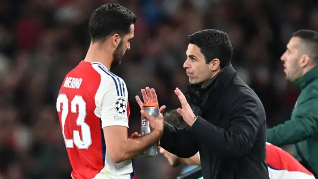 Mikel Arteta, manager of Arsenal, gives instructions to Mikel Merino