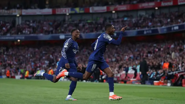 Ousmane Dembele of Paris Saint-Germain celebrates scoring against Arsenal