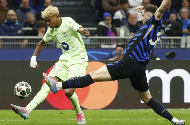 FC Barcelona's Lamine Yamal in action with Inter Milan's Carlos Augusto