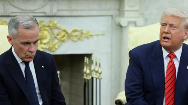 Carney looks down while Trump, sitting next to him, speaks