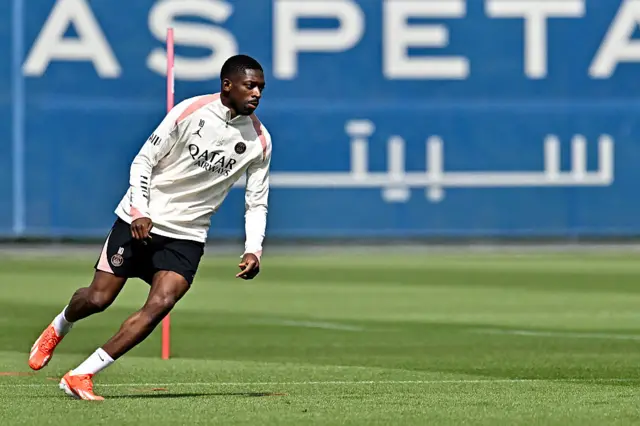 Ousmane Dembele warms up during a Paris Saint-Germain training session
