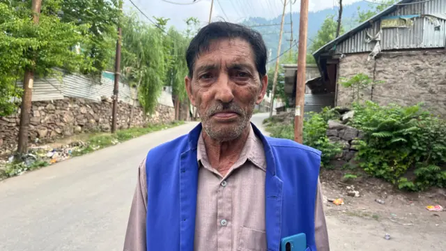 Bashir Ahmad wearing a blue vest