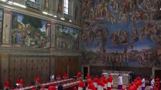 The cardinals arrive in the Sistine Chapel, with its famous frescoes