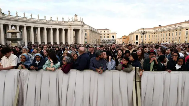 Faithful gather at St. Peter's Square, on the first day of the conclave to elect the new pope