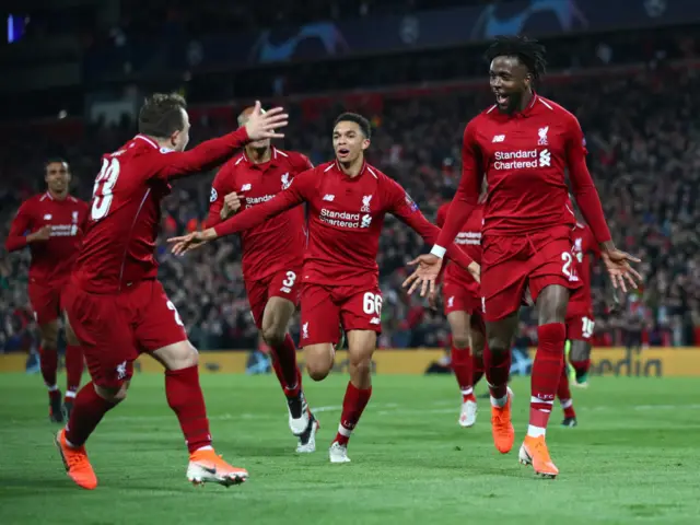 Divock Origi of Liverpool celebrates as he scores his team's fourth goal with team-mates